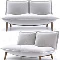 Modern Minimalist White Double Sofa With Wooden Legs In Living Room Interior