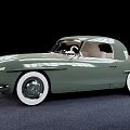 Green Vintage Convertible Car With White Wall Tires And Classic Design