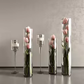 Pink Tulips in Glass Vases with Various Heights and Transparent Candle Holders on Dark Table