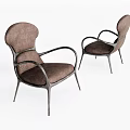 Two Brown Upholstered Accent Chairs With Curved Arms And Slim Metal Legs
