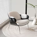 Modern Beige Single Sofa with Black Armrests on Woven Rug Near Window Blinds Small Table Plant and Magazines