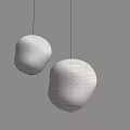 Two Round White Inflatable Lanterns Hanging On Gray Wall For Interior Decor