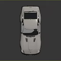Vintage White Two Door Sports Car With Black Roof And Hood Vents