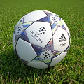 Adidas Champions League Finale Football With Star Pattern On Green Grass