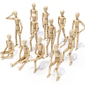 Collection of Wooden Humanoid Dolls in Various Poses Standing and Sitting