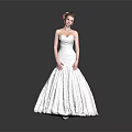 Woman In Strapless White Wedding Dress With Flower Hair Accessory On Gray Background