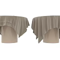Elegant Round Dining Table with Beige Fabric Tablecloth and Soft Draped Edges