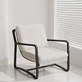 Beige Fabric Accent Chair With Black Metal Frame In White Room With Window Blinds