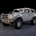 Gray Two Door SUV with Rugged Exterior Design and Large Off Road Tires