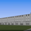 Modern Industrial Factory Building Exterior With Glass Windows White Walls Green Lawn And Blue Sky