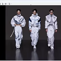 Women Models Walking The Runway In Modern White Outfits With Blue Details