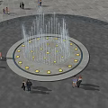 Circular Fountain Featuring Water Jets And Surrounding Lights In Evening Park With Families