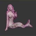 Mermaid Statue With White Body Brown Spots And Blue White Tail Sitting On Black Surface