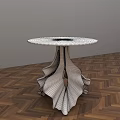Modern Coffee Table With Glass Top And White Black Leaf Shaped Legs On Wooden Floor