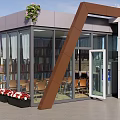 Modern Glass Building With Bookshelves Chairs Flowers And Water Dispenser