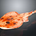 Orange Red Ray with Flat Body and Dark Spots on Black Background Showing Reflection