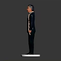 Man In Black Suit With Flower Garland Standing On White Pedestal