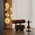 Modern Floor Lamp With Multiple White Round Shades In Living Room With Brown Armchair
