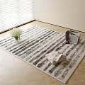Square Gray and White Striped Rug on Herringbone Wooden Floor with White Flowers Magazines and Clothes