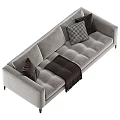 Gray Sectional Sofa With Plush Dark Brown And Checkerboard Pattern Pillows And Tasseled Throw Blanket 3d model
