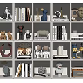 Decorative Ornament Sets On Cube Shelves With Books Sculptures Clocks Masks And Radios
