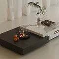 Modern Living Room Stacked Coffee Tables Black White Marble Top Green Plant Book Teapot Oranges