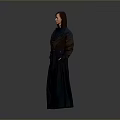 Stylish Woman In Long Dark Coat With Brown And Blue Panels And Pockets Standing