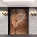 Elegant Copper Textured Double Doors With Leaf Shaped Inlay Against Marble Wall And Wall Sconces