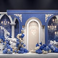Elegant Blue And Gold Wedding Setup With Ornate Arches Chandeliers And Flower Arrangements