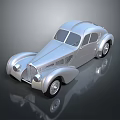 Silver Vintage Classic Car With Streamlined Body And Retro Headlights