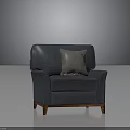 Vintage Distressed Blue Armchair With Gray Pillow And Solid Wooden Legs