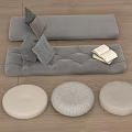 Cozy Gray Floor Seating With Throw Pillows Open Book And Round Cushions On Wooden Floor