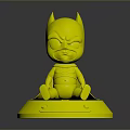 Cute Baby Batman Toy Figure Sitting On White Base With Pink Outfit And Logo