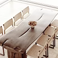 Natural Wooden Dining Table Set With Rattan Chairs And Bowl Of Fruits In Bright Room
