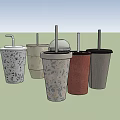 Assorted Disposable Drink Cups With Straws And Various Design Patterns