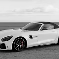 White Mercedes AMG Convertible Sports Car Featuring Black Top And Sporty Exterior Design