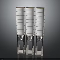 Three Tall White Multi Layered Industrial Storage Silos With Base Supports