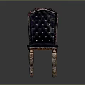 Luxurious Tufted Chair With Deep Blue Upholstery And Ornate Carved Wooden Legs