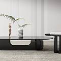 Modern Black Coffee Table With Glass Top And Side Table Decorated With Plant Books Statue