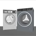 Two Modern Front Load Washing Machines Silver And Dark Gray Contemporary Home Laundry Appliances