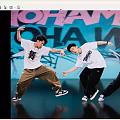 Men Dancing With Dynamic Moves In White T Shirts And Casual Pants Against Graffiti Wall