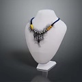 Stylish Decorative Necklace On White Mannequin With Blue Yellow Beads And Black Feather Accents