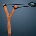 Wooden Slingshot With Y Shaped Frame Black Rubber Bands And Projectile