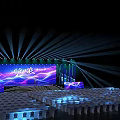 Illuminated Stage with Aurora Effect Purple Blue Background and Performer on Steps