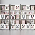 Modern Rabbit Ear Design Bookshelf With Pink White Storage Boxes And Gold Frame
