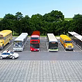 Different Types of Buses Parked in Outdoor Parking Lot With Green Trees Blue Sky