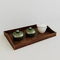Elegant Tea Set with Green Lidded Jars and White Lidded Jar on Wooden Tray