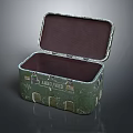 Vintage Green Decorative Ornament Set Featuring Open Metal Box With Dark Interior