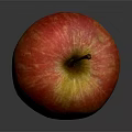 Fresh Red and Yellow Striped Apple With Stem on Dark Background Showing Reflection