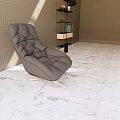 Modern Lounge Area with Tufted Gray Chair Marble Floor Light Brown Wall and Green Plant
